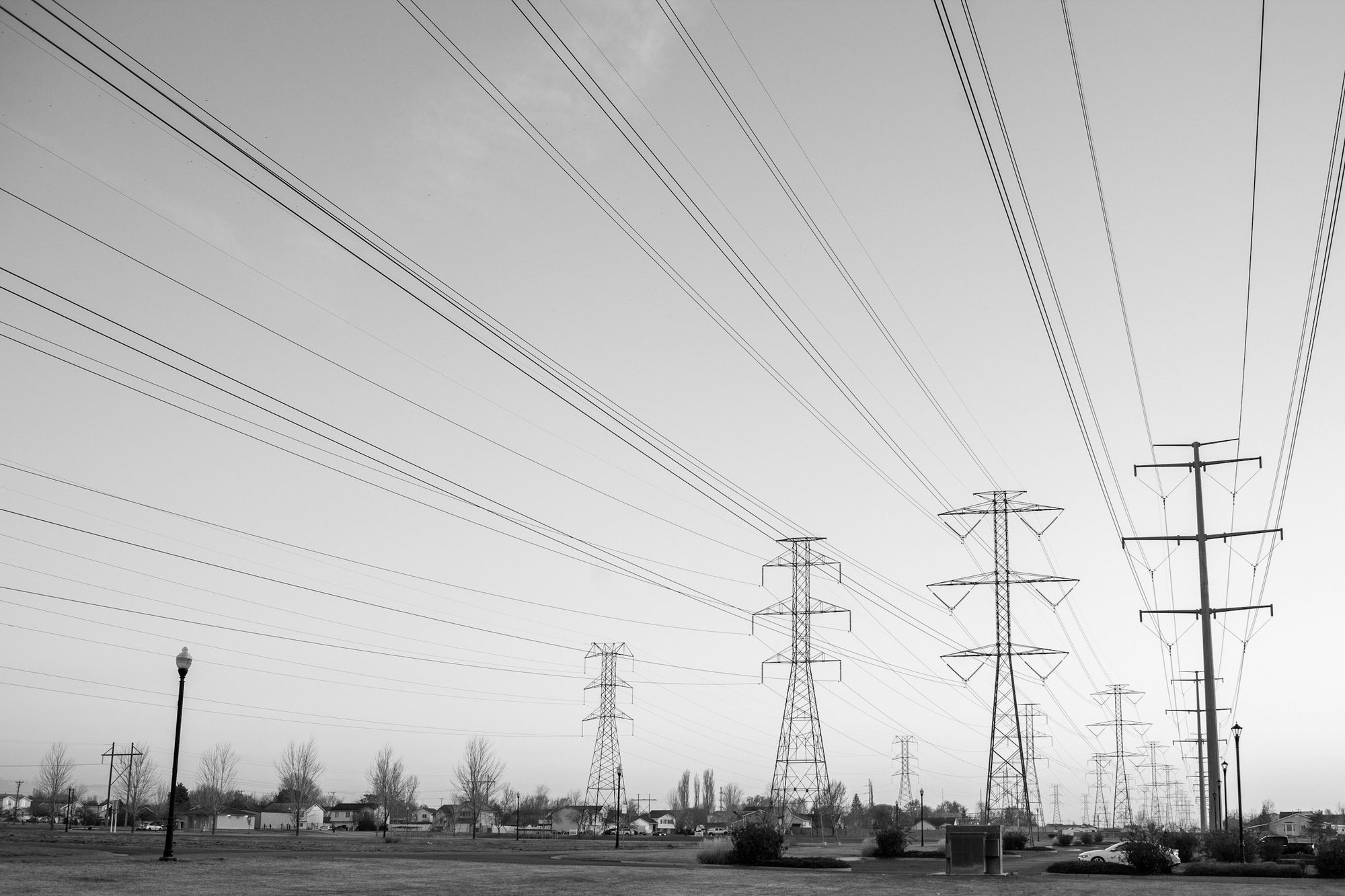 High-voltage transmission towers and conductors against the sky
