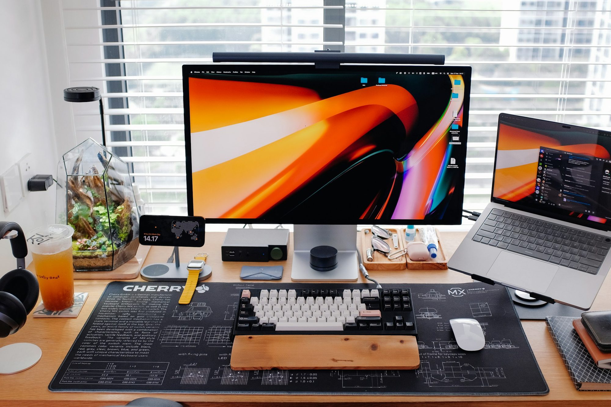 A modern desk setup with a monitor and laptop for technical work